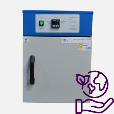 Contrast media warmer with door shut and sustainability symbol.