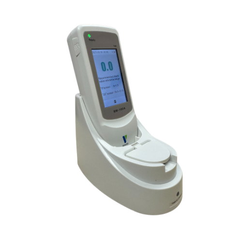 Croyde jaundice meter in charging base with screen turned on.
