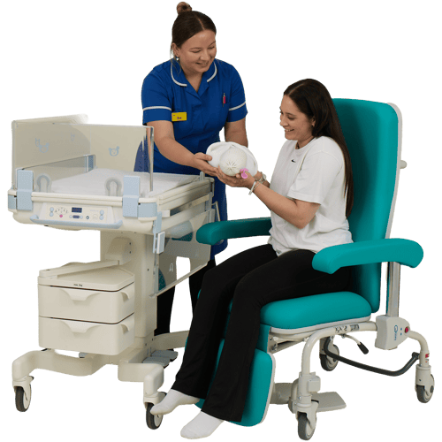 Midwife Handing Baby to Mum in Kangaroo Chair Next to Lifetherm 2000 (500 x 500)