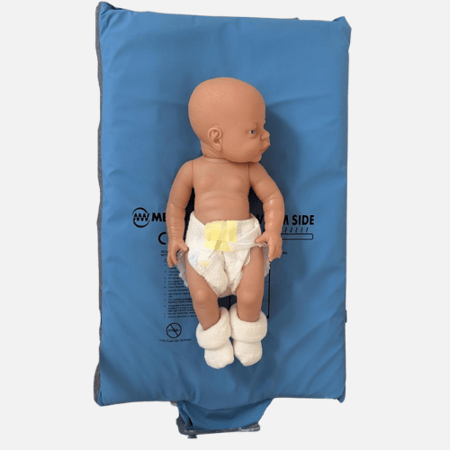Baby doll in a nappy on a Medwarm neo mattress. Baby doll in a nappy on a Medwarm neo mattress.