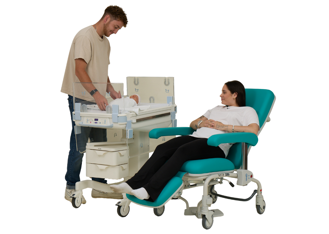 Mum in Kangaroo chair next to Dad stood with baby in Lifetherm