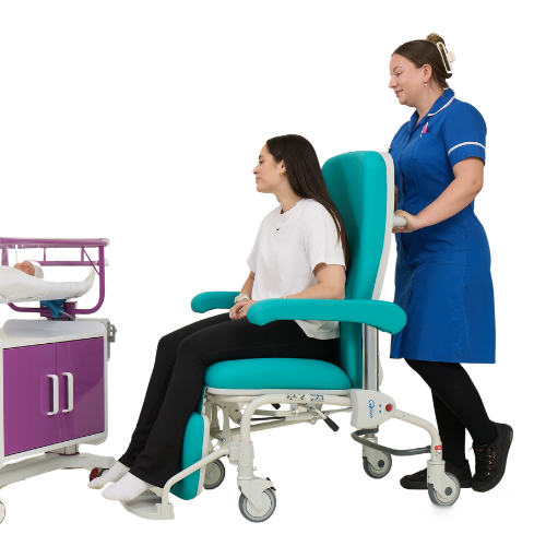 Midwife Pushing Mum in Kangaroo Chair to Baby in Cot (500 x 500 Cutout)