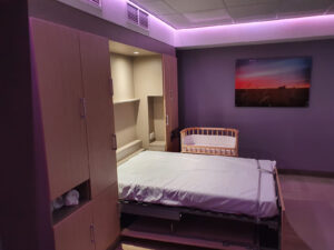 Birth room with baby cot and mood lighting